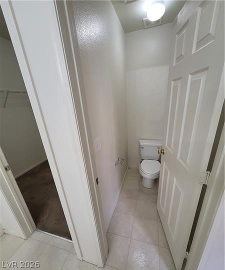 677 Principle Point Avenue Henderson, NV 89012 - Photo 27 of 40 Bathroom with a walk in closet and light tile patterned floors