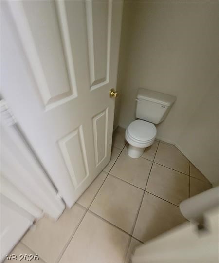 677 Principle Point Avenue Henderson, NV 89012 - Photo 28 of 40 Bathroom with toilet and light tile patterned floors