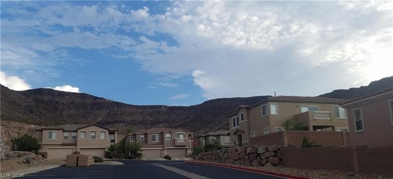 677 Principle Point Avenue Henderson, NV 89012 - Photo 38 of 40 View of asphalt road featuring a mountain view, a residential view, and curbs