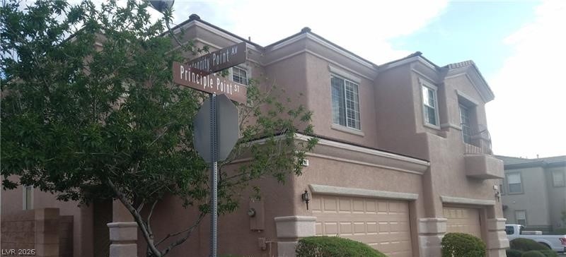 677 Principle Point Avenue Henderson, NV 89012 - Photo 40 of 40 View of apartment building / complex featuring an attached garage