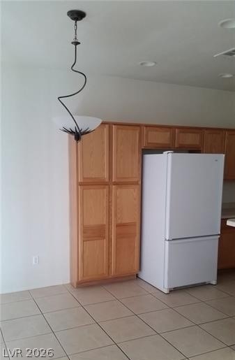 677 Principle Point Avenue Henderson, NV 89012 - Photo 8 of 40 Kitchen featuring freestanding refrigerator and light tile patterned floors