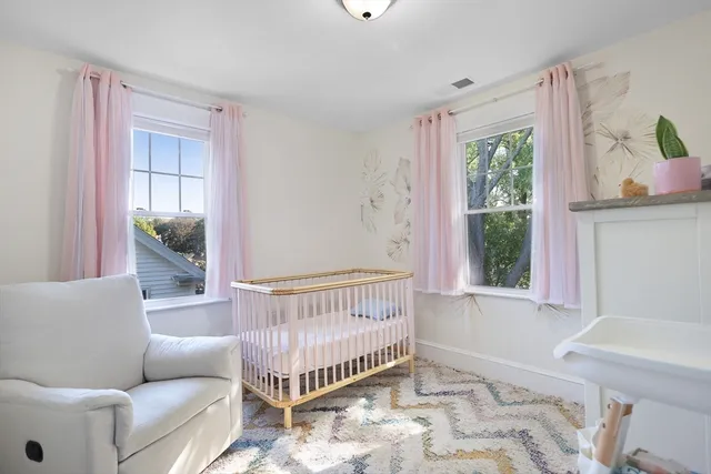 a bedroom with furniture and a window