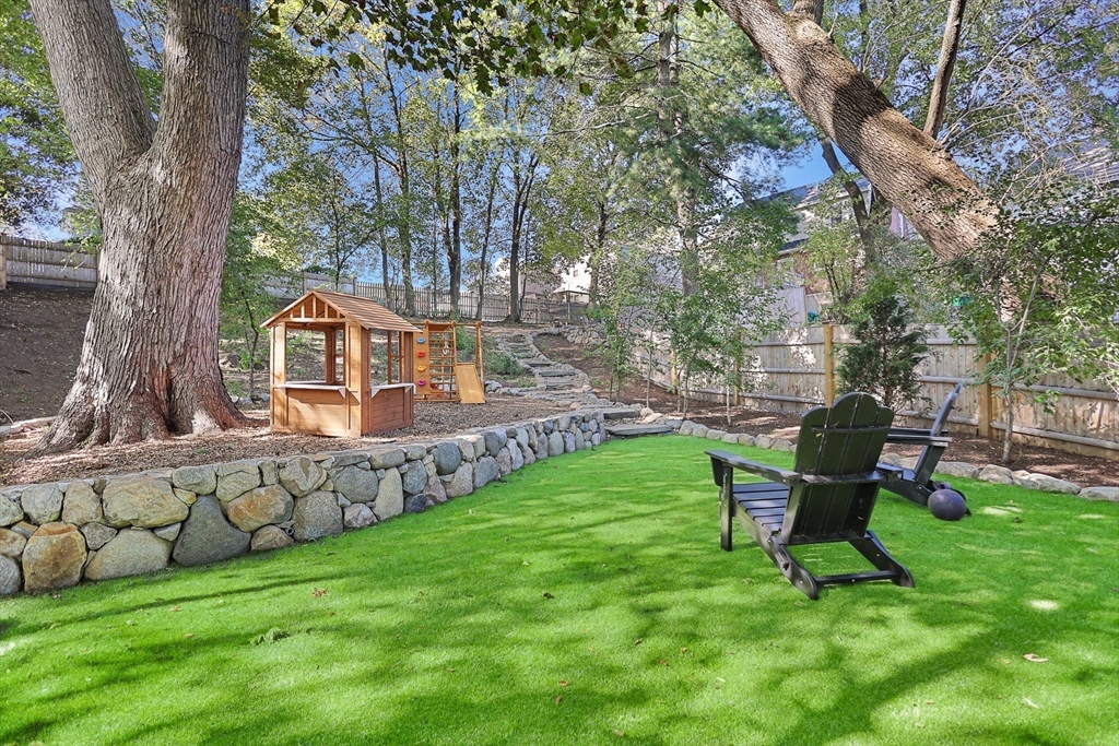 15 Whitman Road Medford, MA 02155 - Photo 32 of 39 a view of a chair and table in backyard of the house