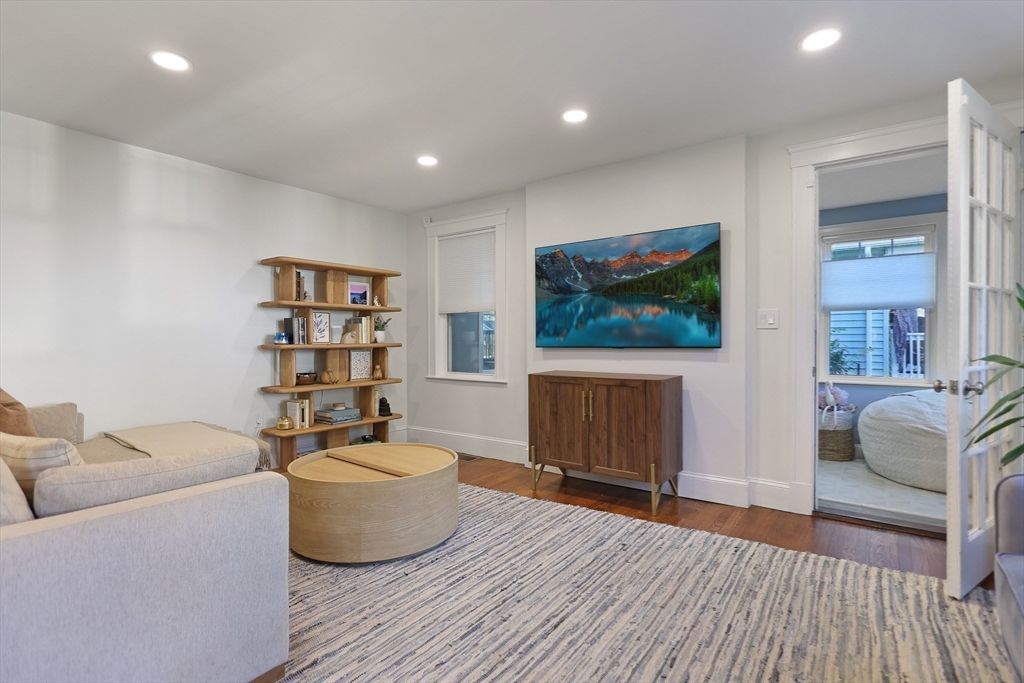 15 Whitman Road Medford, MA 02155 - Photo 8 of 39 a living room with furniture and a flat screen tv