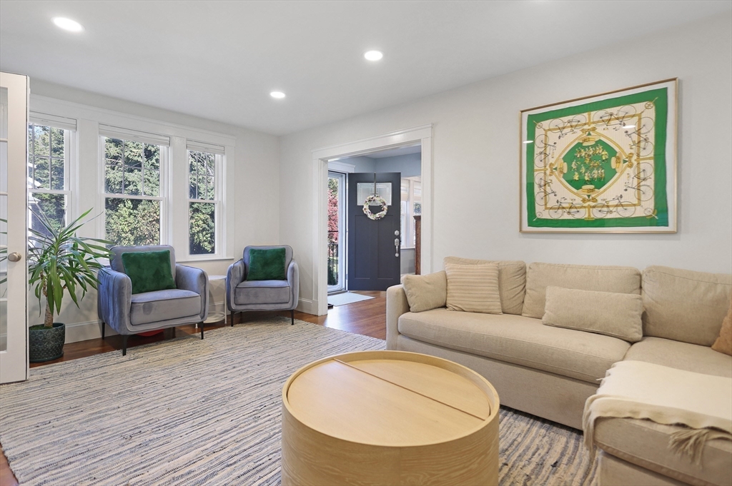 15 Whitman Road Medford, MA 02155 - Photo 10 of 39 a living room with furniture and a wooden floor
