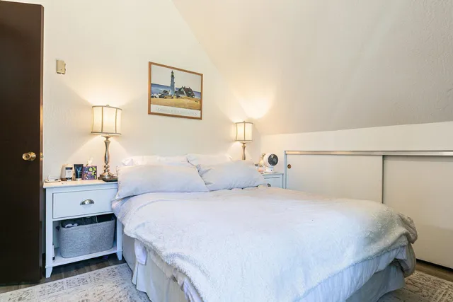 a bedroom with a bed and a cabinets