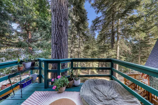 a view of roof deck with furniture