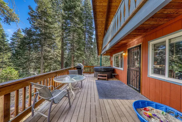 a balcony view with couple of chairs