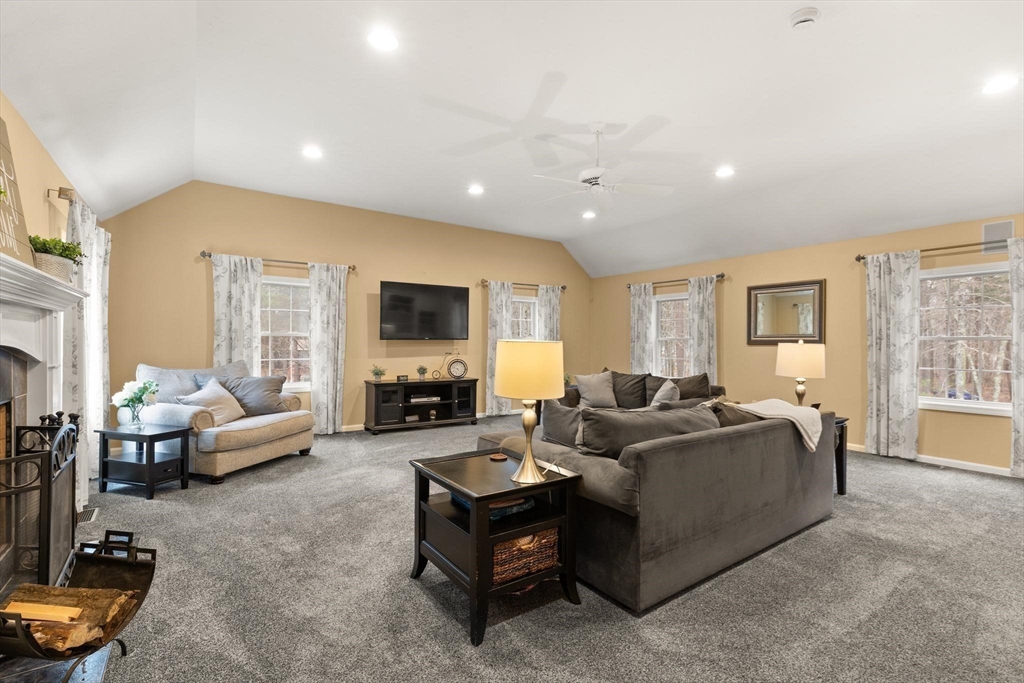 41 Chestnut Road Tyngsborough, MA 01879 - Photo 15 of 32 a living room with furniture and a flat screen tv