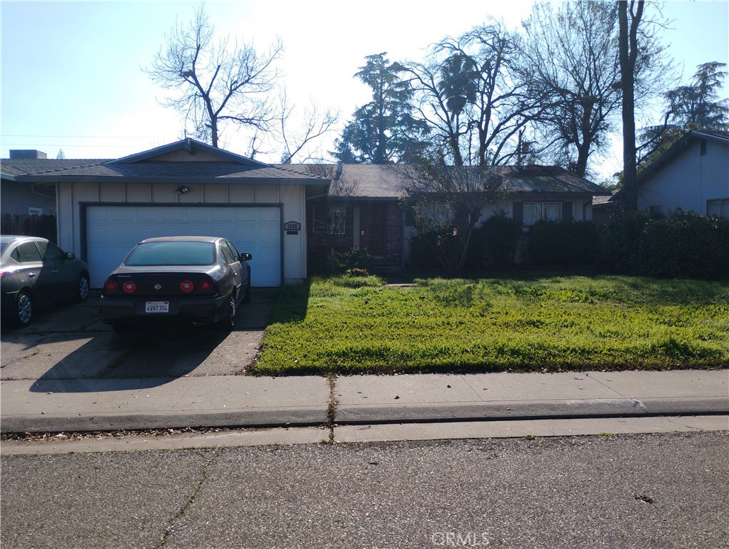 2552 Tamarisk Avenue Stockton, CA 95207 - Photo 1 of 1 a front view of a house with a garden and yard