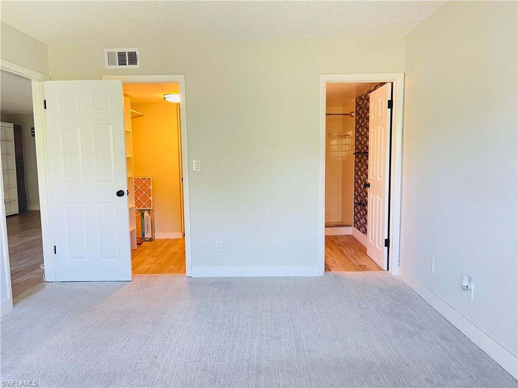 5499 Rattlesnake Hamm Road, Unit 2 Naples, FL 34113 - Photo 16 of 34 a view of a bathroom with a tub and a sink