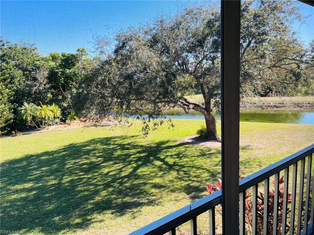 5499 Rattlesnake Hamm Road, Unit 2 Naples, FL 34113 - Photo 2 of 23 View from lanai of lake, golf course and landscaped area