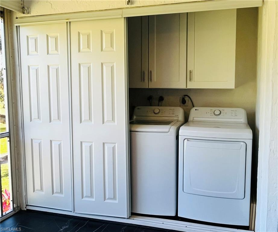 5499 Rattlesnake Hamm Road, Unit 2 Naples, FL 34113 - Photo 21 of 23 Laundry area featuring cabinet space and washer and dryer
