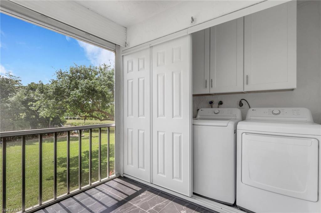 5499 Rattlesnake Hamm Road, Unit 2 Naples, FL 34113 - Photo 25 of 34 a utility room with dryer and washer