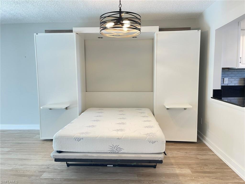 5499 Rattlesnake Hamm Road, Unit 2 Naples, FL 34113 - Photo 28 of 34 a bathroom with a sink and a mirror