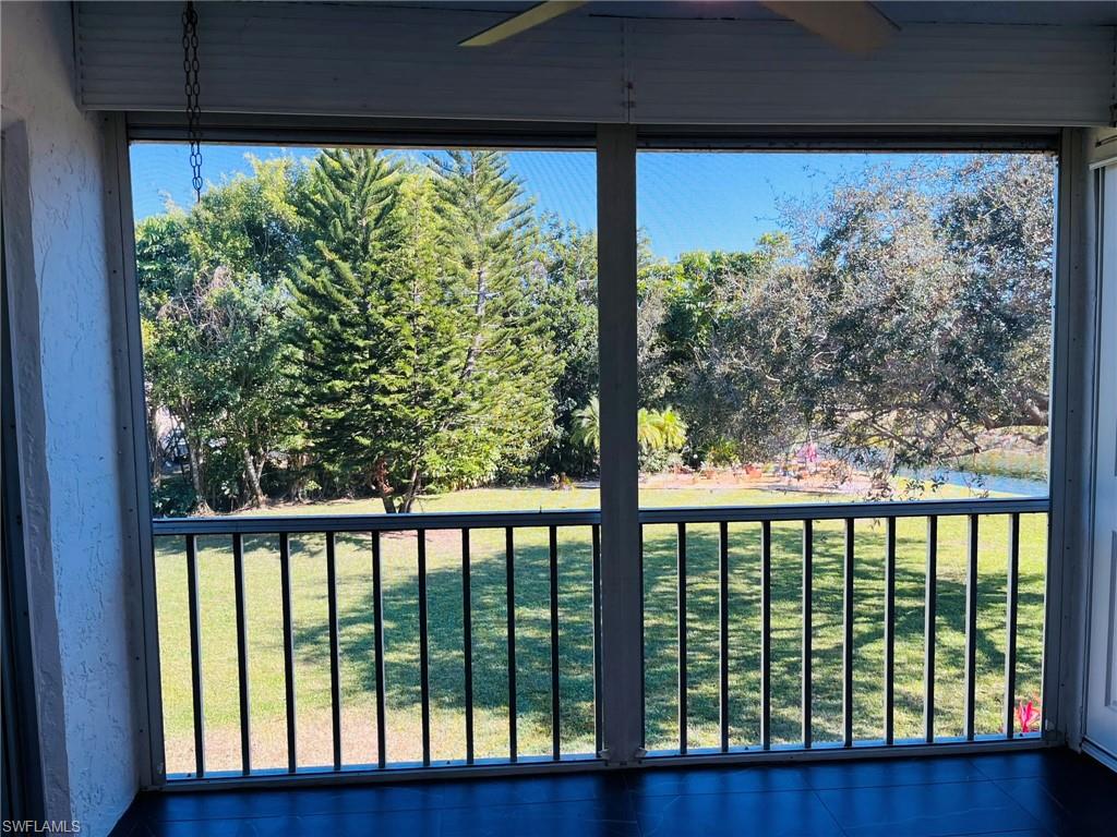 5499 Rattlesnake Hamm Road, Unit 2 Naples, FL 34113 - Photo 3 of 23 Lanai facing lake, golf course and landscaped area