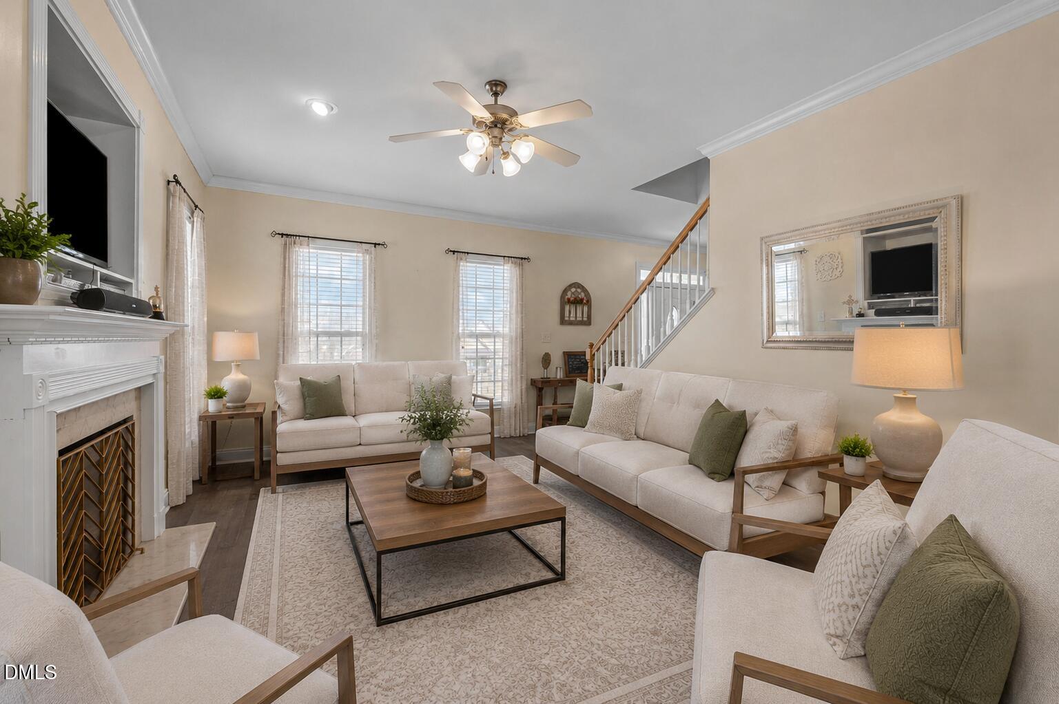 51 Water Front Lane Timberlake, NC 27583 - Photo 10 of 29 a living room with furniture a fireplace and a flat screen tv