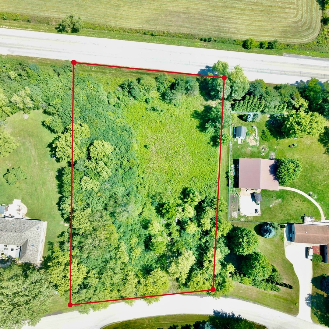 6510 Suttondale Road Huntley, IL 60142 - Photo 1 of 5 an aerial view of a yard with plants