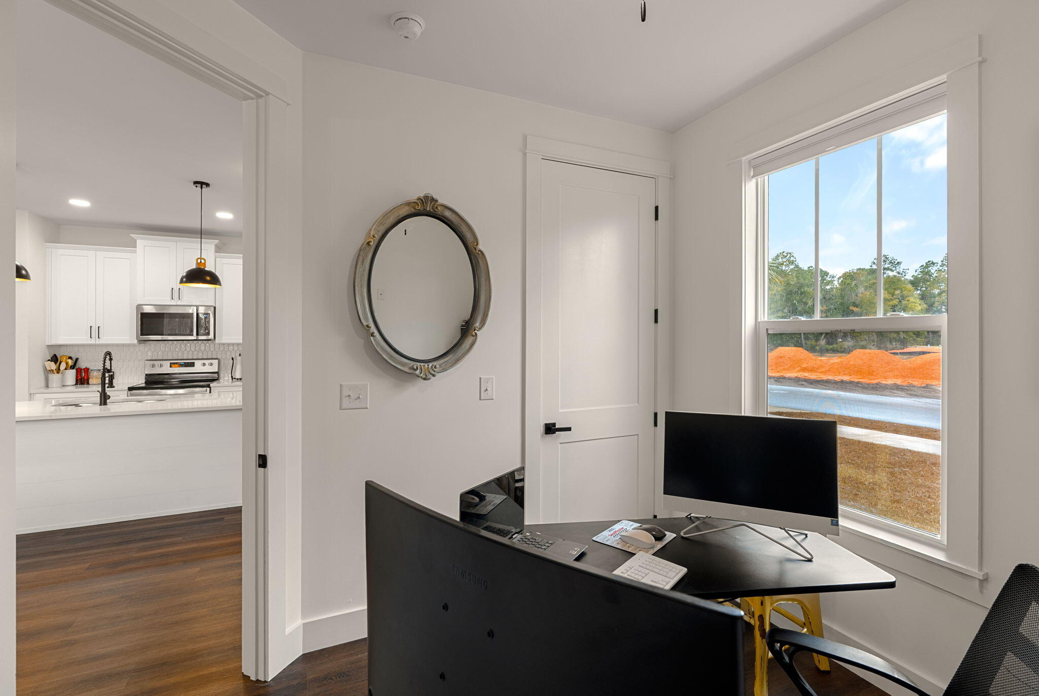 135 Clarke Hl Road Freeport, FL 32439 - Photo 13 of 41 a view of a workspace room with wooden floor and windows