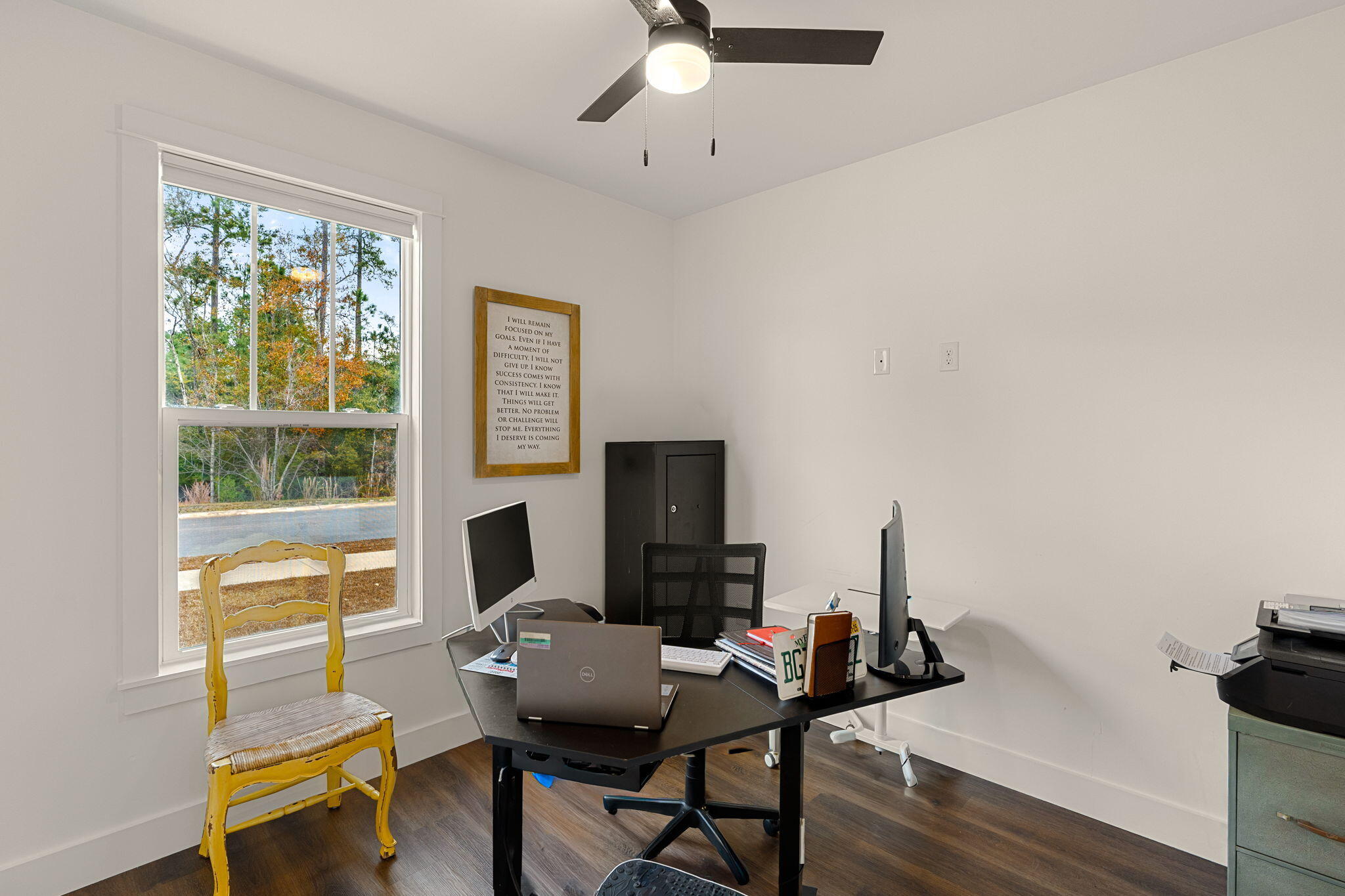 135 Clarke Hl Road Freeport, FL 32439 - Photo 14 of 41 a workspace with furniture hardwood and a window