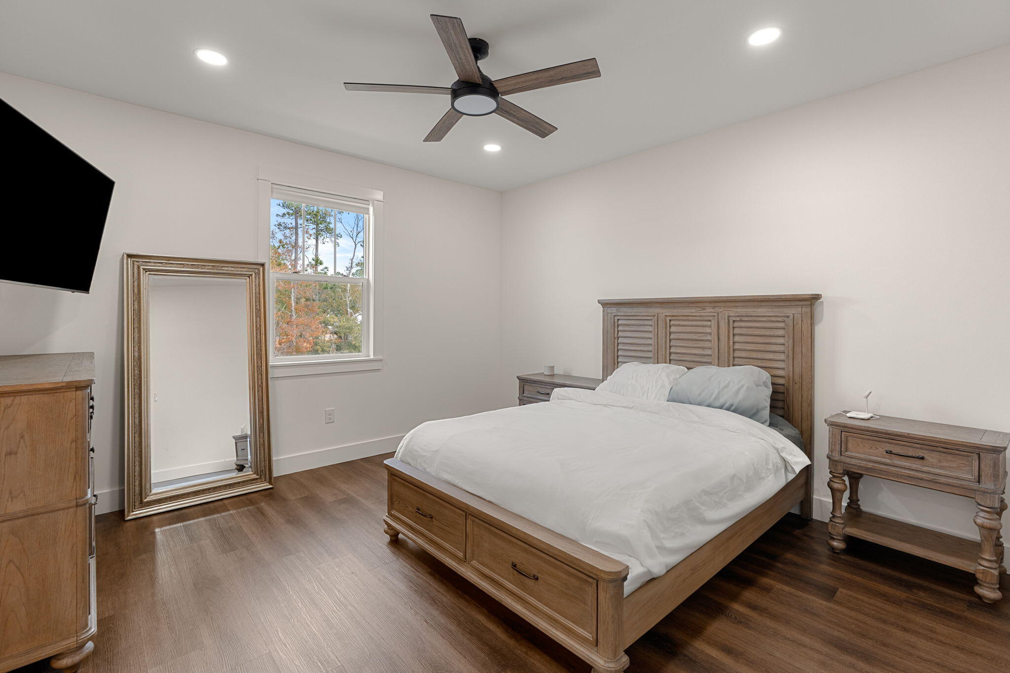 135 Clarke Hl Road Freeport, FL 32439 - Photo 17 of 41 a bedroom with a bed and a flat screen tv