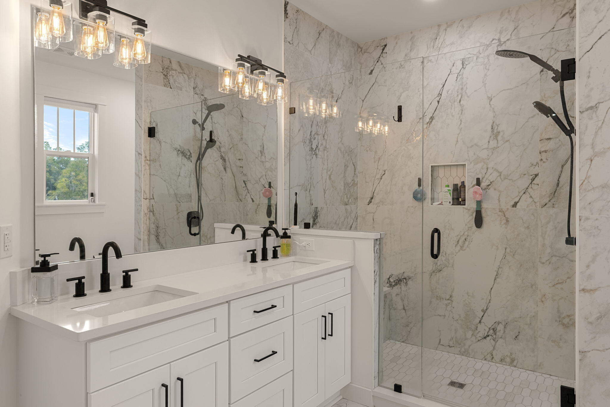 135 Clarke Hl Road Freeport, FL 32439 - Photo 19 of 41 a bathroom with a shower sink and mirror