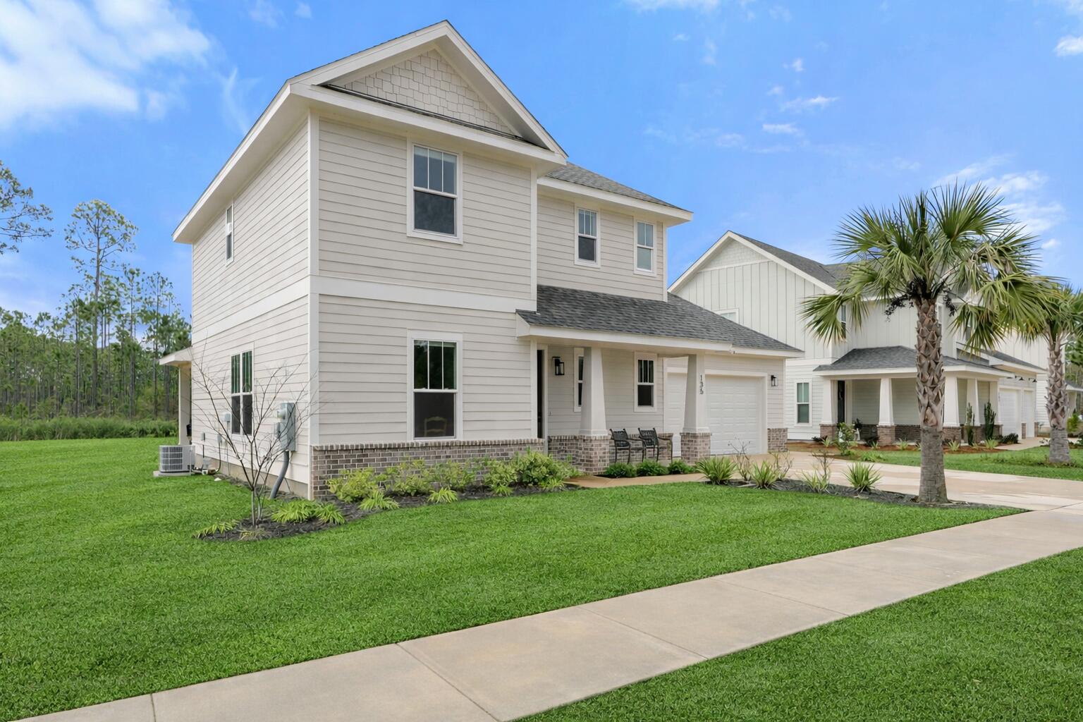 135 Clarke Hl Road Freeport, FL 32439 - Photo 2 of 41 a front view of a house with a yard and trees