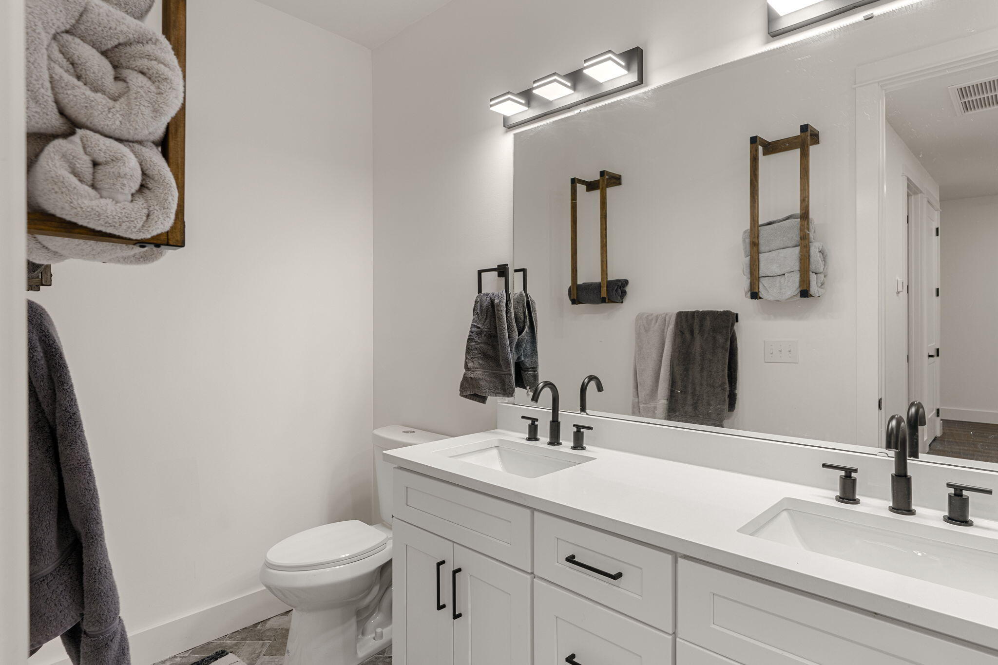 135 Clarke Hl Road Freeport, FL 32439 - Photo 24 of 41 a bathroom with a toilet sink and mirror