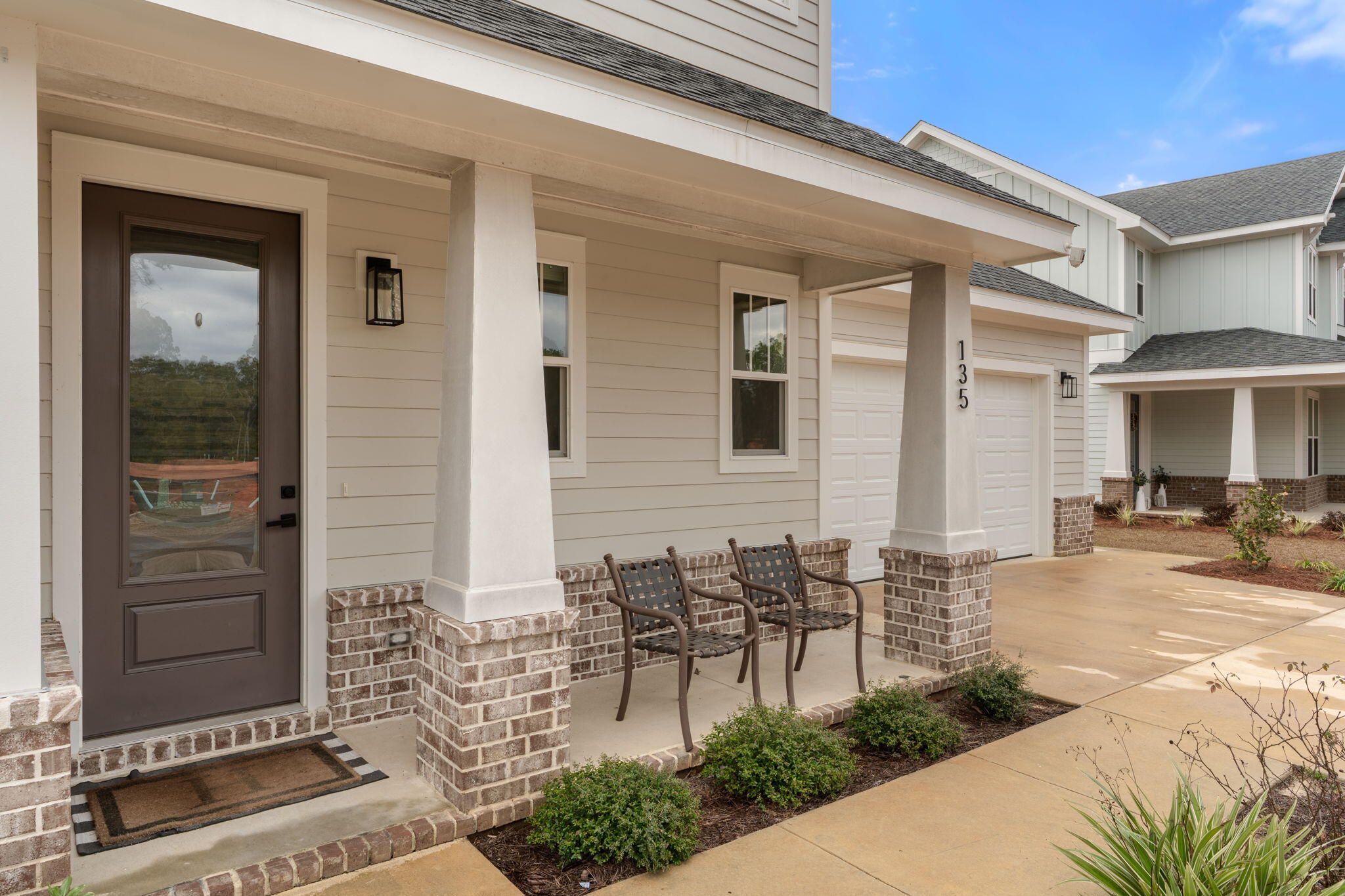 135 Clarke Hl Road Freeport, FL 32439 - Photo 3 of 41 a view of a patio with table and chairs and potted plants