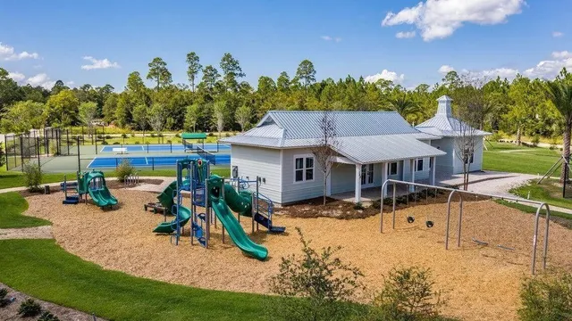 a view of a house with backyard porch and sitting area