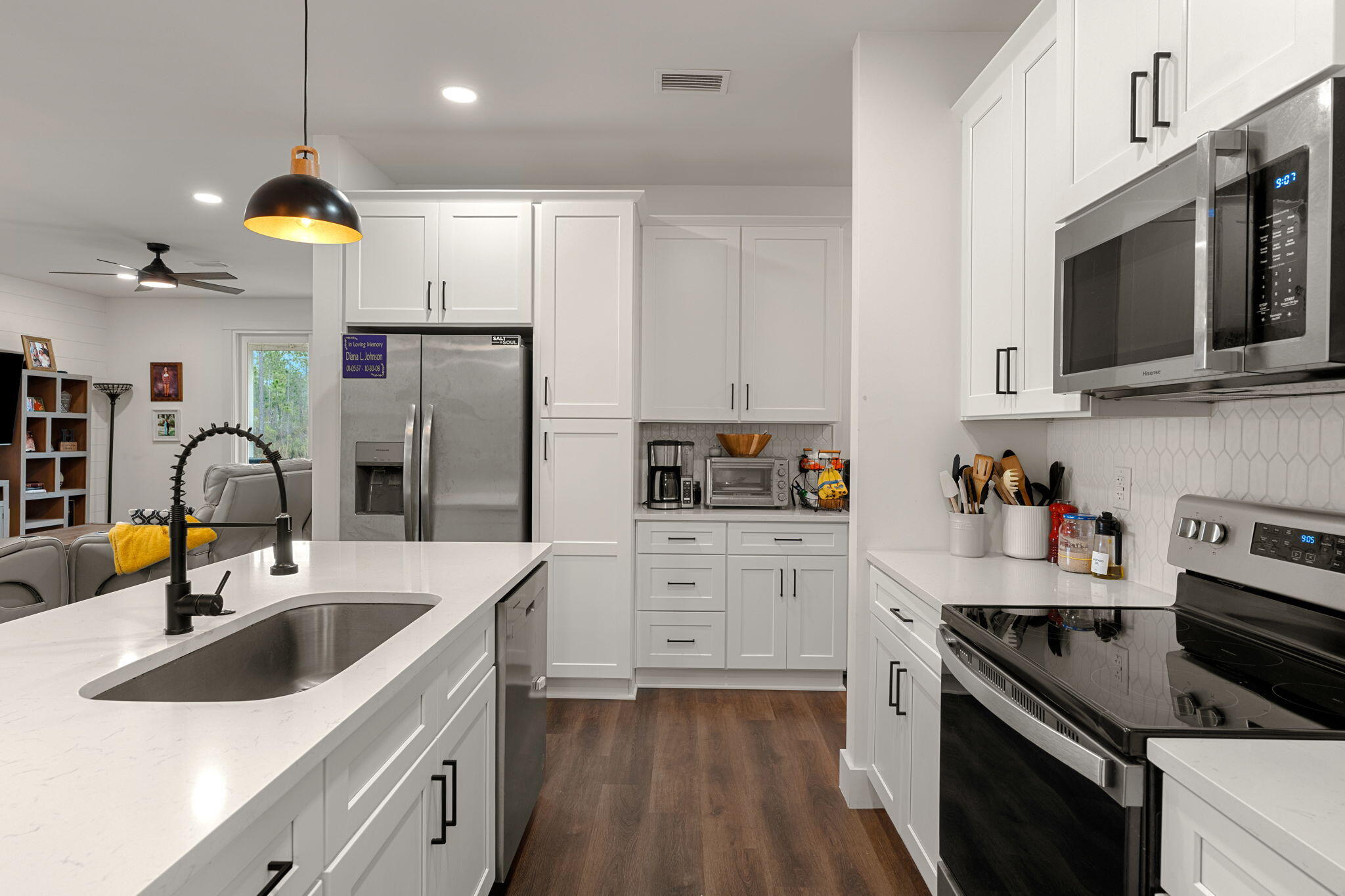 135 Clarke Hl Road Freeport, FL 32439 - Photo 5 of 41 a kitchen with stainless steel appliances granite countertop a sink stove and refrigerator