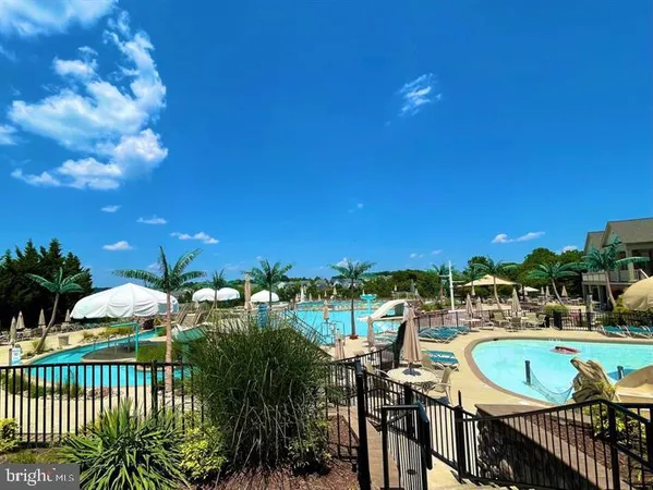 a view of a swimming pool and outdoor space