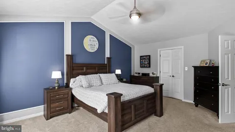 a bed room with a bed and a lamp