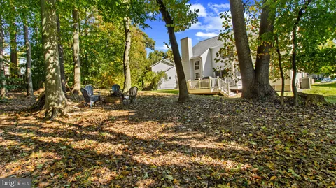 a view of outdoor space with deck and trees