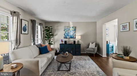 a living room with furniture and a rug