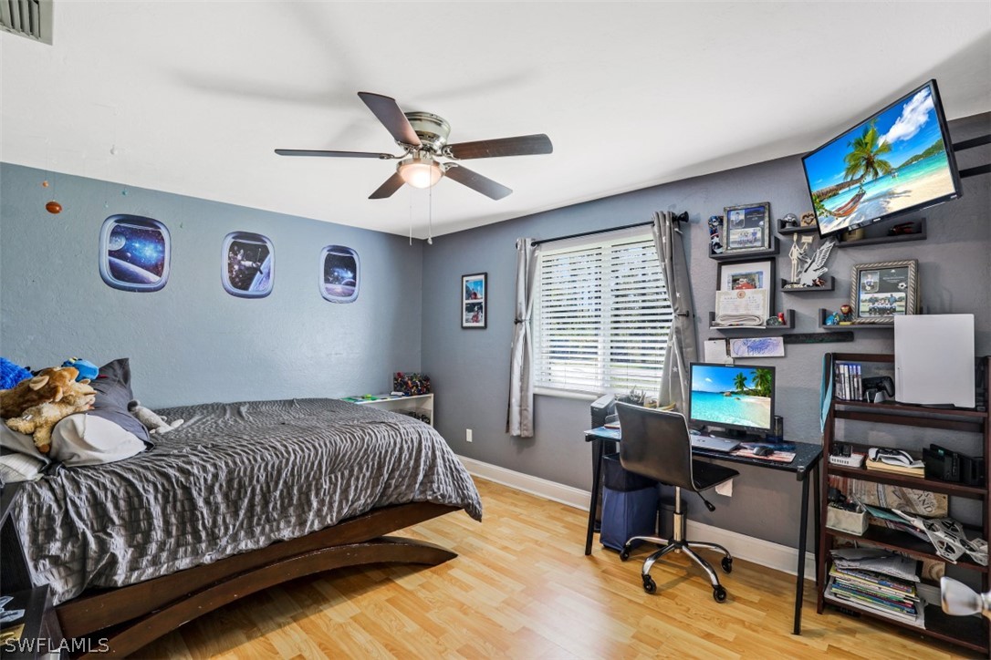 701 East 14th Street Lehigh Acres, FL 33972 - Photo 12 of 31 a bedroom with a bed and furniture