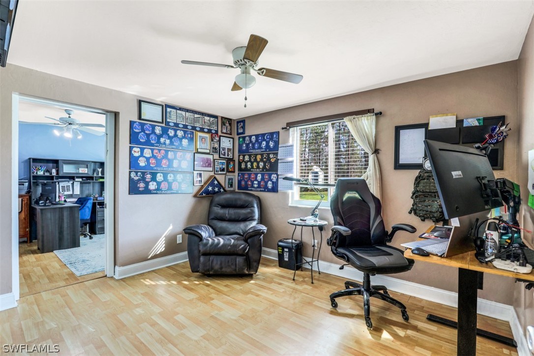 701 East 14th Street Lehigh Acres, FL 33972 - Photo 15 of 31 a view of a livingroom with workspace and a window