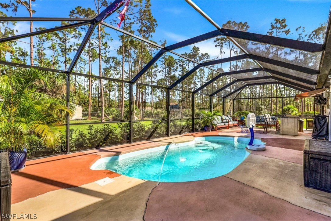701 East 14th Street Lehigh Acres, FL 33972 - Photo 21 of 31 a view of a swimming pool with a patio