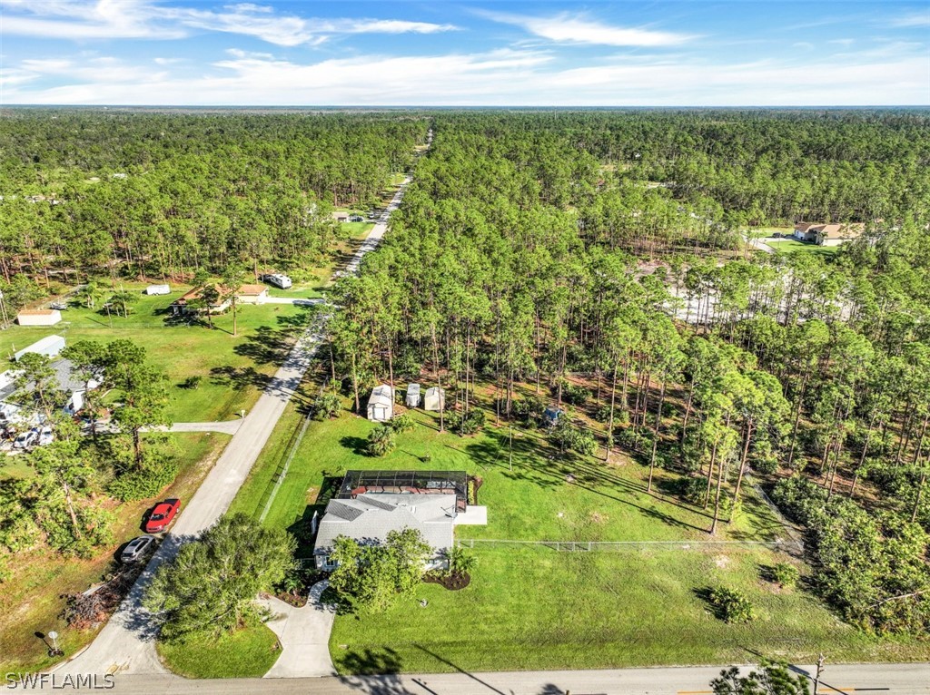 701 East 14th Street Lehigh Acres, FL 33972 - Photo 27 of 31 a view of a yard with an outdoor space