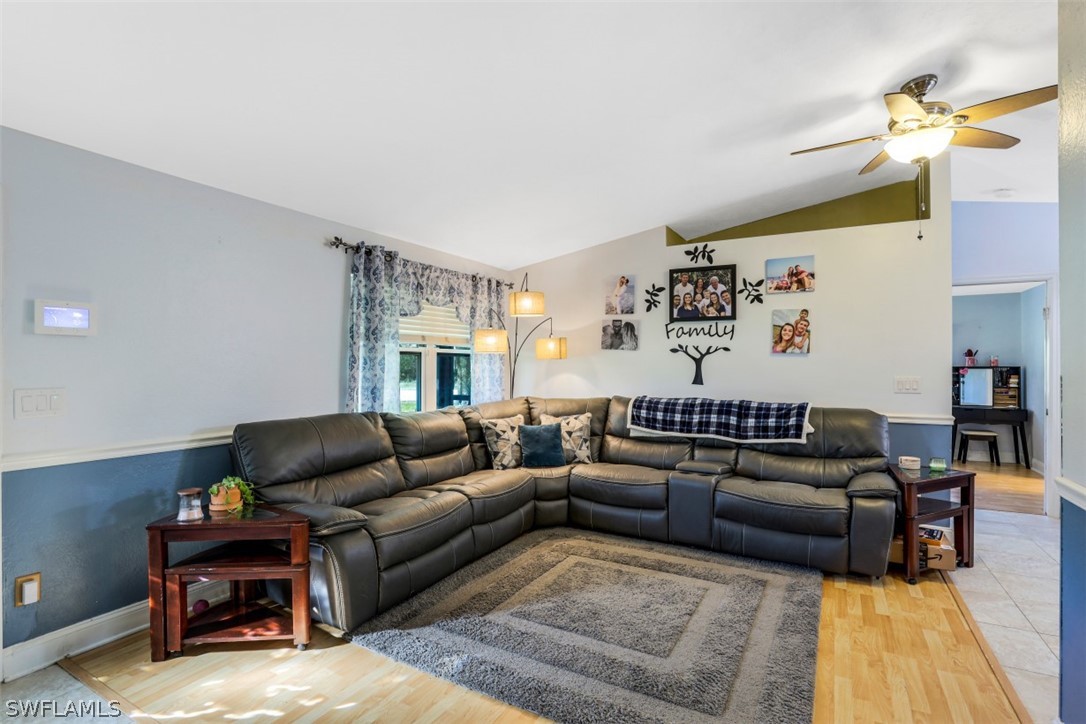 701 East 14th Street Lehigh Acres, FL 33972 - Photo 4 of 31 a living room with furniture and a couch
