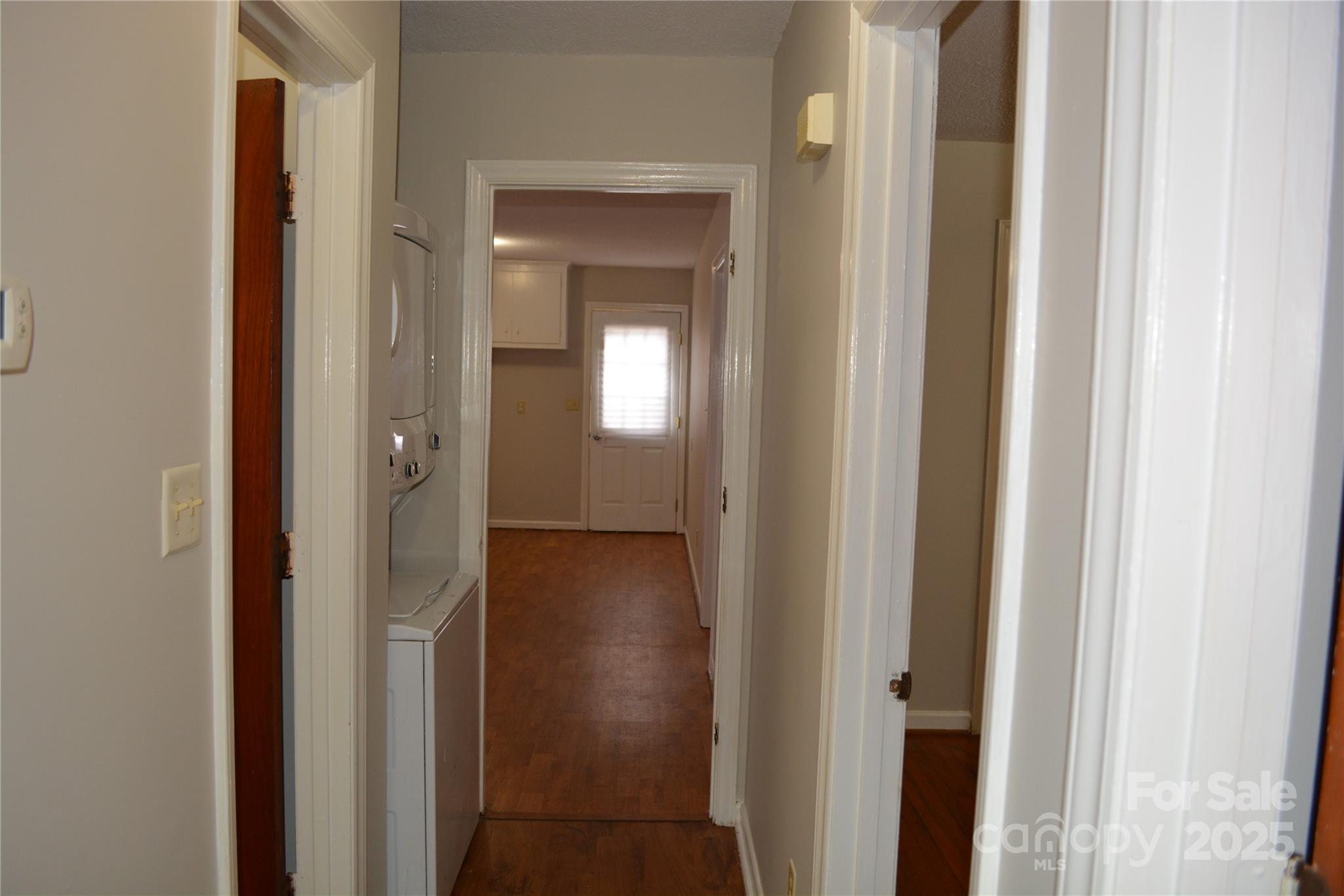 1206 Borders Road Shelby, NC 28150 - Photo 11 of 25 a view of a bathroom from a hallway with wooden floor