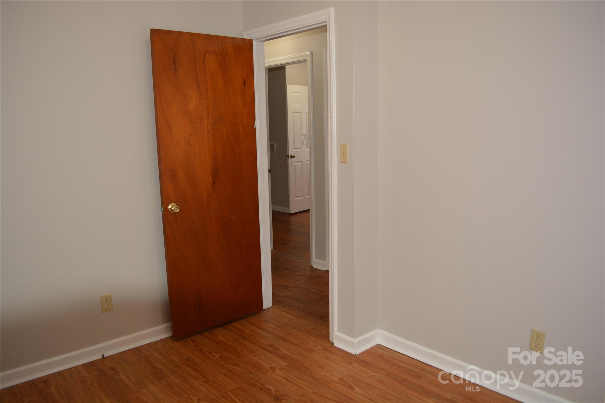 1206 Borders Road Shelby, NC 28150 - Photo 18 of 25 a view of an empty room with wooden floor and closet