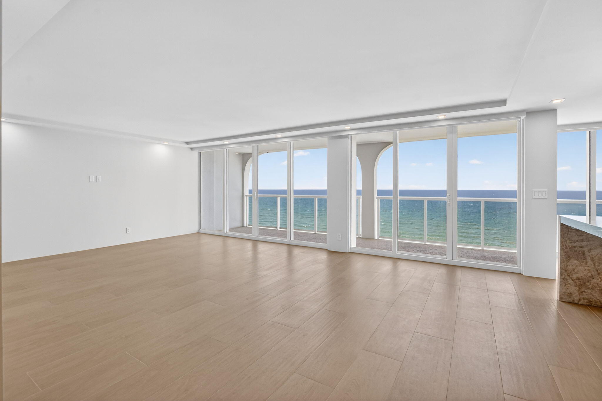 2800 South Ocean Boulevard, Unit 23C Boca Raton, FL 33432 - Photo 4 of 50 wooden floor in an empty room with a window