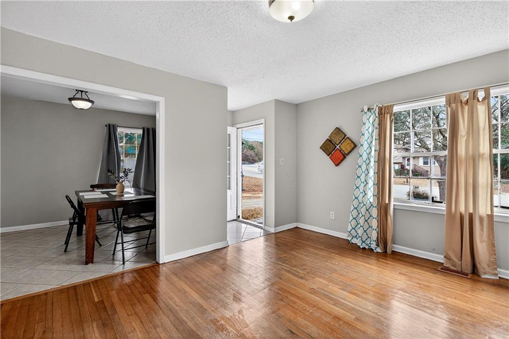 1742 Cardinal Road Hampton, GA 30228 - Photo 11 of 25 wooden floor in an empty room with a window