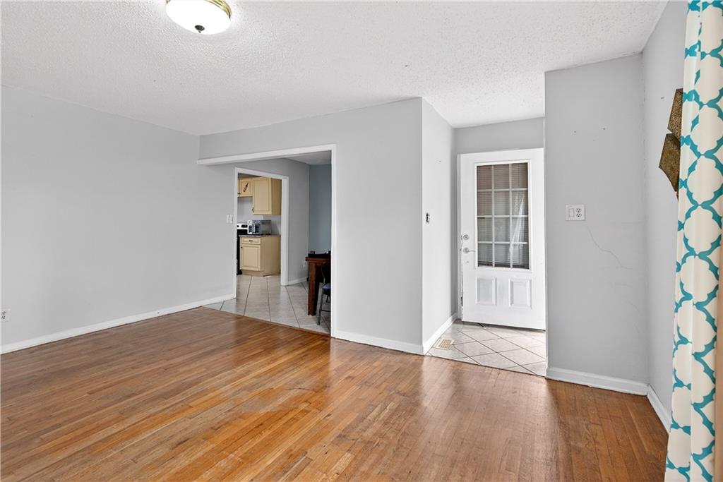 1742 Cardinal Road Hampton, GA 30228 - Photo 12 of 25 wooden floor in an empty room
