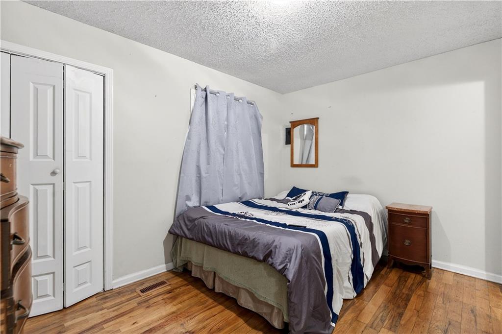 1742 Cardinal Road Hampton, GA 30228 - Photo 13 of 25 a bedroom with a bed and a mirror