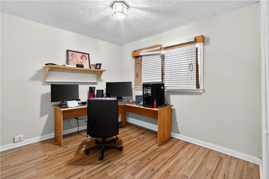 1742 Cardinal Road Hampton, GA 30228 - Photo 18 of 25 a living room with furniture and a fireplace