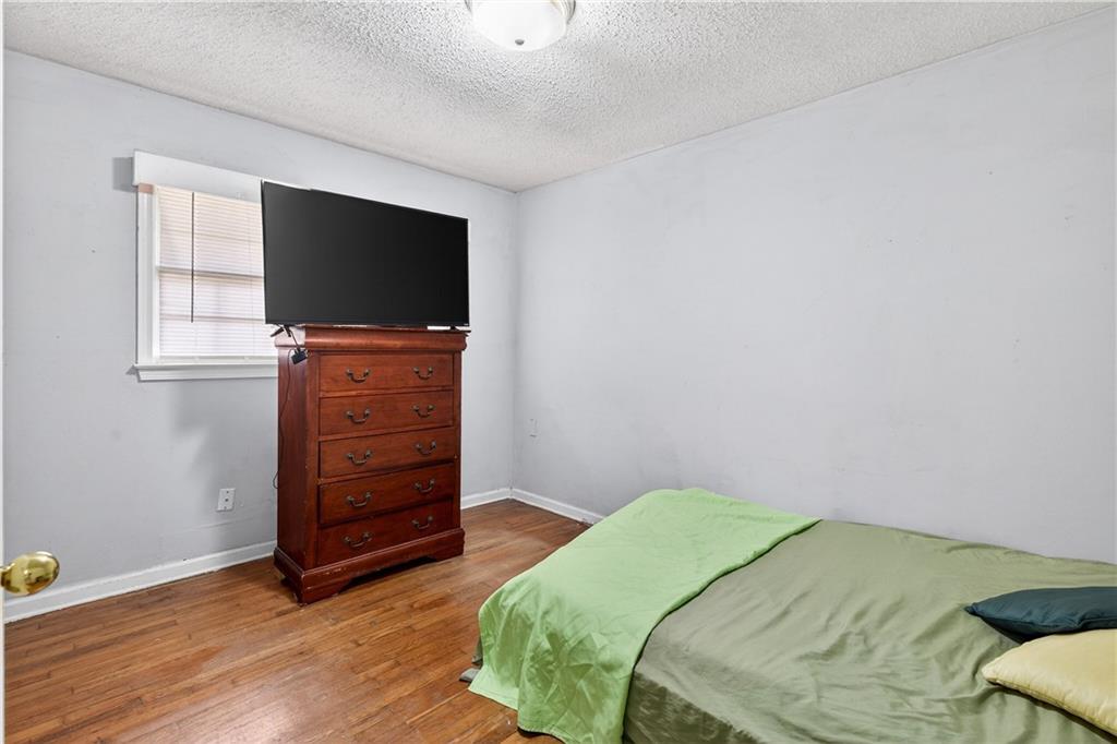 1742 Cardinal Road Hampton, GA 30228 - Photo 19 of 25 a bedroom with a bed and flat screen tv