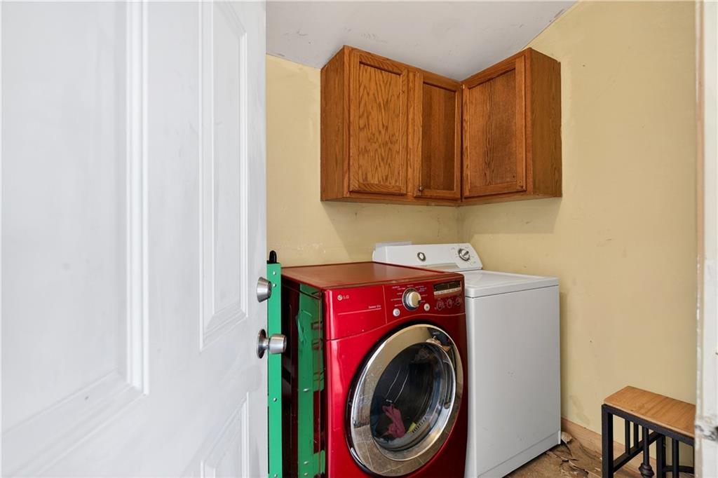 1742 Cardinal Road Hampton, GA 30228 - Photo 20 of 25 a utility room with dryer and washer
