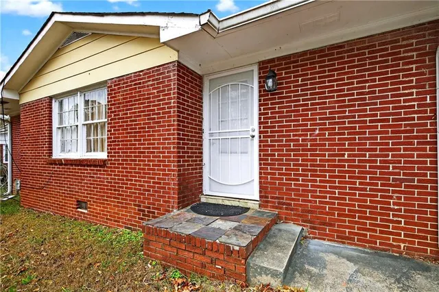 a view of brick building with many windows